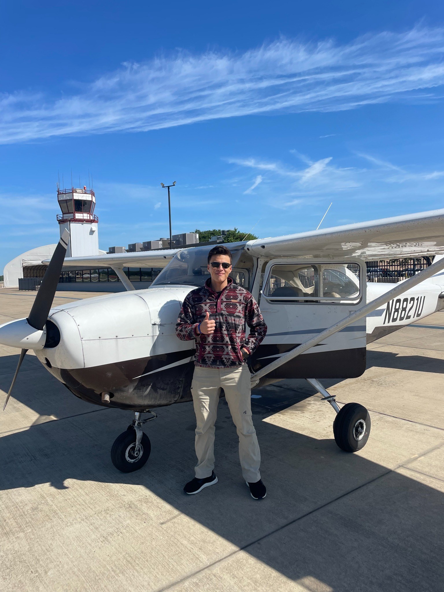 Alexei Pistoun standing beside a light aircraft