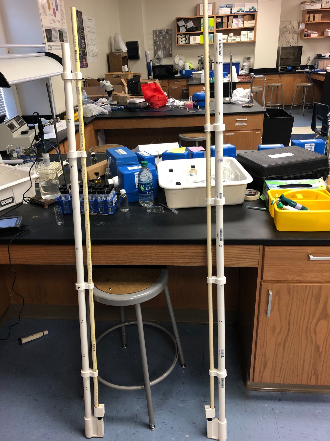 Two PVC depth-sampling tools in a laboratory